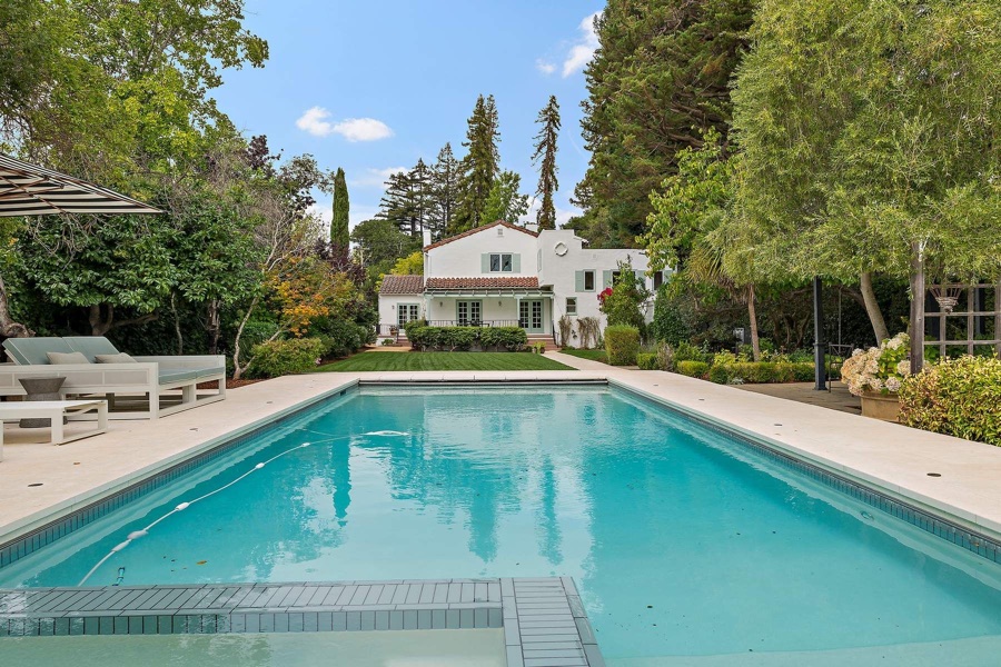 San Mateo home behind a long pool
